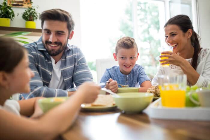 Family enjoying lunchtime and eating healthy.