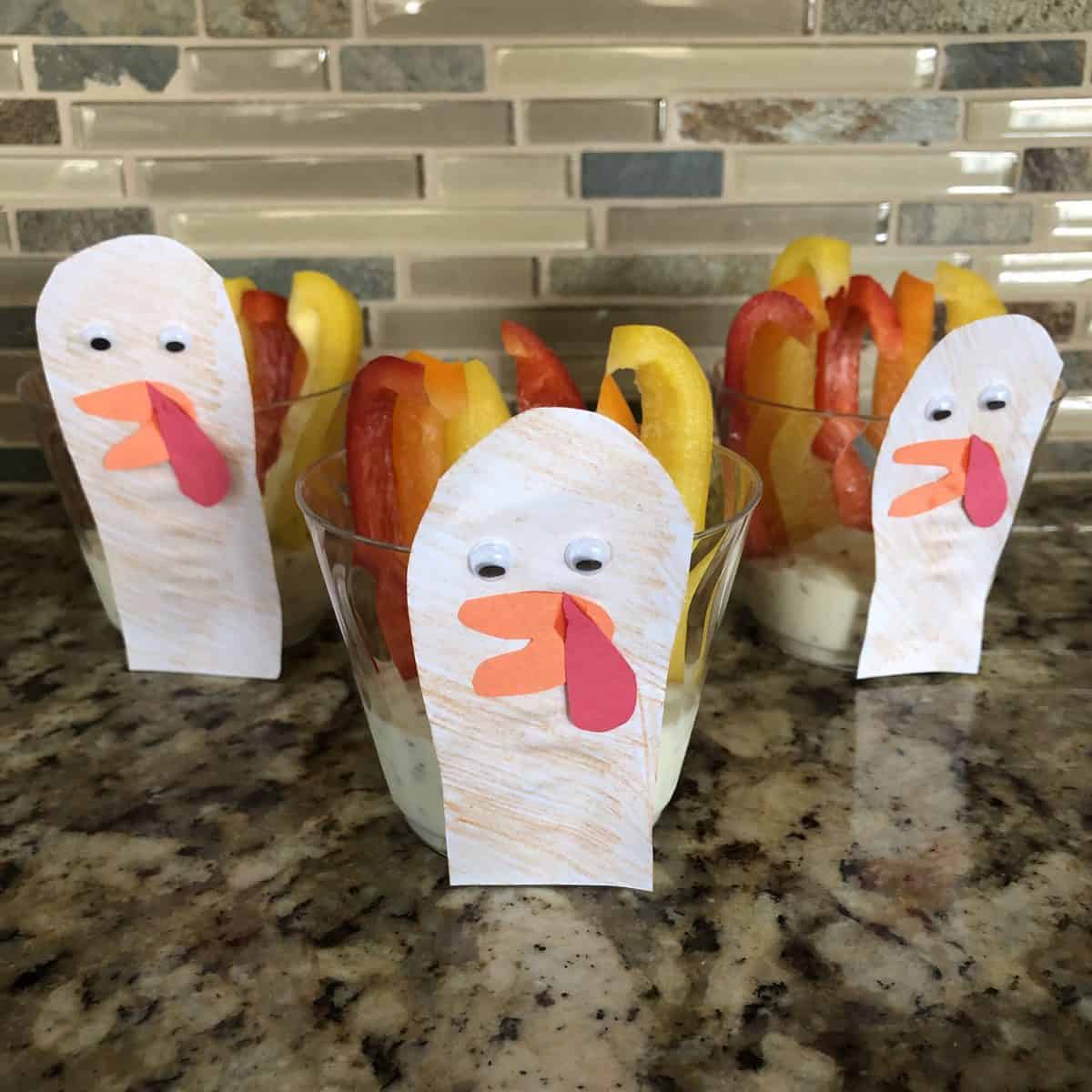 Bell peppers dipped in ranch on cups for Thanksgiving