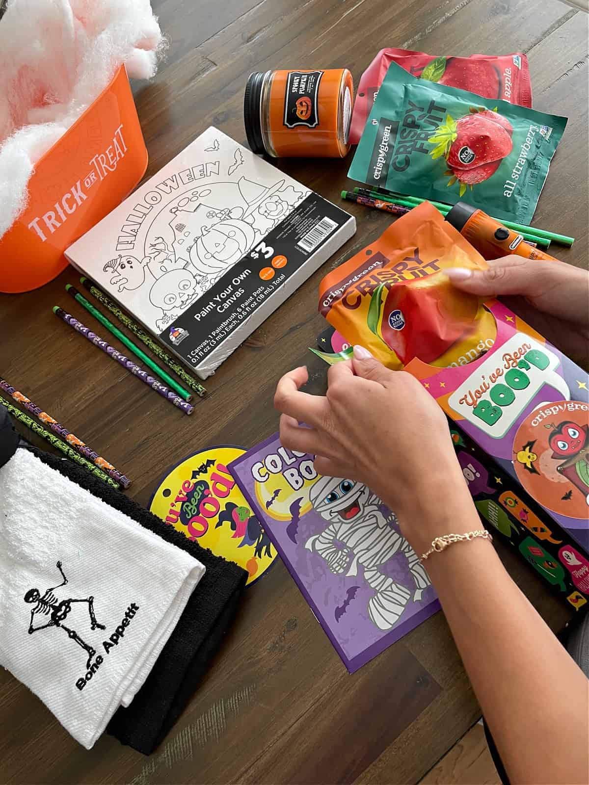 Putting together Boo'd Baskets for Halloween gifts