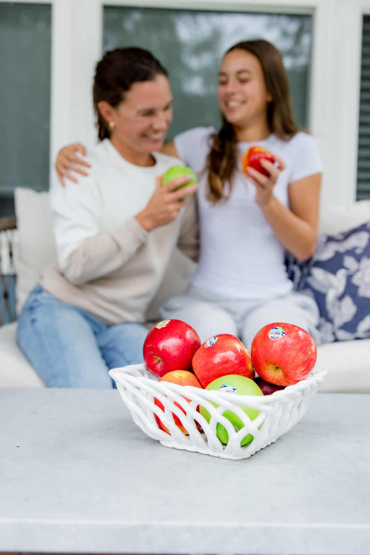 Mom and daughter comparing apples to apples.