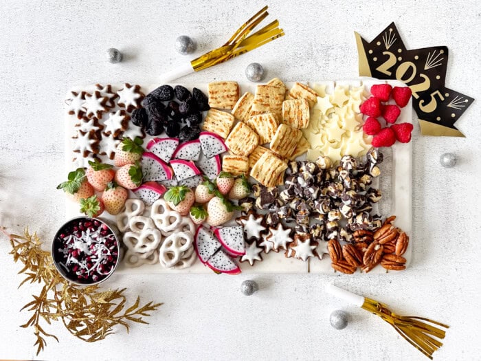 Sweet board with New Year's decorations.